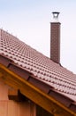 New house with orange brick wall, roof and chimney. House building worker concept. Royalty Free Stock Photo