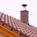 New house with orange brick wall, roof and chimney. House building worker concept. Royalty Free Stock Photo