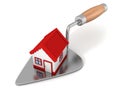New house with red roof on construction trowel Royalty Free Stock Photo