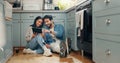 New house, renovation and couple with digital tablet on a kitchen floor for idea, search or inspiration. Real estate Royalty Free Stock Photo