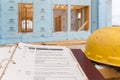 A new house under construction and new home closing documents folder Royalty Free Stock Photo