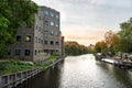 New housing building by the canal in Amsterdam at the sunset Royalty Free Stock Photo