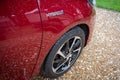 New Hybrid Vehicle showing its alloy wheel and deep lustre metallic paintwork.