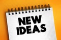New Ideas text on notepad, concept background Royalty Free Stock Photo