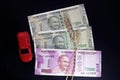 Indian currencies. 500, and 2000 rupee notes with Wheat grains and red color toy car. Indian currency isolated on black background Royalty Free Stock Photo