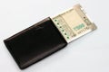 New Indian currency of 500 rupee notes into the money purse. Royalty Free Stock Photo