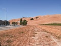 New industrial land in summer drought colours subdivided and roaded awaiting development of new buildings