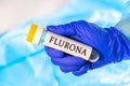 New infectious Flurona twindemic desease of Flu Influenza and Corona Covid-19, Ncov sample in lab tube in the scientist hand