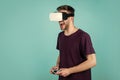 New innovations. guy getting experience using VR-headset glasses. man in virtual reality goggles. game console using Royalty Free Stock Photo