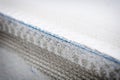 New installed plastering angle bead with blue plastic mesh on the external corner of a window. Selective focus and shallow depth