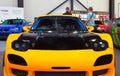 New Japanese tuned yellow sports car. Face View. Close up.