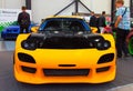 New Japanese tuned yellow sports car. Face View.
