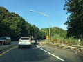 New Jersey Turnpike off ranmp at rush hour on Summer day. Lots of traffic.