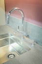 A new kitchen sink with an artificial stone countertop. The concept of modern kitchen interior. Vertical photography Royalty Free Stock Photo