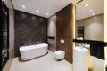 New large bathroom with white bathroom mirror and lighting Royalty Free Stock Photo