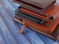New leather multicolored wallets on blue background