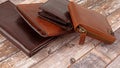 New leather multicolored wallets on wooden background