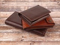 New leather multicolored wallets on wooden background