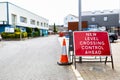 `New level crossing control ahead` sign in a town centre informing the public of the change