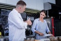 Experienced cook explaining to a woman how to cook