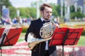 New Life Brass band classical quintet of brass wind musical instruments, orchestra performs music, man musician plays French horn