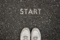 New Life Concept, Motivational Slogan with Word START on the ground of asphalt