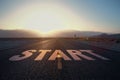 New life, new future and new way concept with start word printed on a road on skyline at sunset. 3D rendering Royalty Free Stock Photo