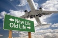 New Life, Old Life Green Road Sign and Airplane Above Royalty Free Stock Photo