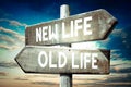 New life, old life - wooden signpost, roadsign with two arrows Royalty Free Stock Photo