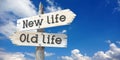 New life, old life - wooden signpost with two arrows Royalty Free Stock Photo