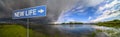 New Life sign on background of amazing landscape nature before thunder storm. Dark clouds cover blue sky at wild river. Incredible Royalty Free Stock Photo