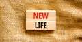 New life symbol. Concept words New life on wooden blocks on a beautiful canvas table canvas background. Business, support, Royalty Free Stock Photo