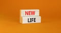 New life symbol. Concept words New life on wooden blocks on a beautiful orange table orange background. Business, support, Royalty Free Stock Photo