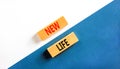 New life symbol. Concept words New life on wooden blocks on a beautiful white and blue background. Business, support, motivation, Royalty Free Stock Photo