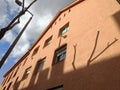 New light brown stucco finished building exterior facade in abstract view