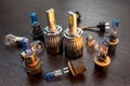 New light halogen car bulbs on dark background, vehicle headlight spare parts