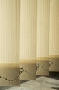 New light yellow vertical strip blinds close up