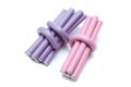 Lilac and pink  hair curlers on a white background Royalty Free Stock Photo