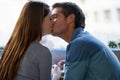 New love knows no boundries. a young couple kissing in a cafe.