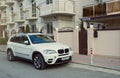 New luxury BMW x5 parked near house in street of the Sochi city.
