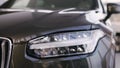 New luxury car Volvo XC90 in oficial dealership, left headlight