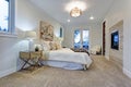 New luxury custom built home with white master bedroom.