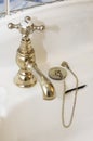 New luxury hotel vintage brass gold plated pillar taps in ensuite bathroom at wash basin