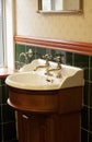 New luxury hotel vintage brass gold plated pillar taps in ensuite bathroom at wash basin