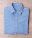 New man blue shirt on wood background Royalty Free Stock Photo