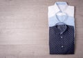 New man`s shirt on wood background. Royalty Free Stock Photo