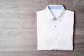 New man shirt white on wood background. Royalty Free Stock Photo