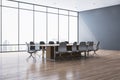 New meeting room interior with reflections on wooden flooring and panoramic window with city view and daylight. Commercial office Royalty Free Stock Photo