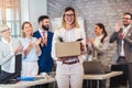 New member of team, newcomer, applauding to female employee, congratulating office worker