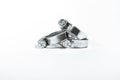 New metal hose clamps with threaded connection for pipes, stainless steel, small size on isolated white background close-up